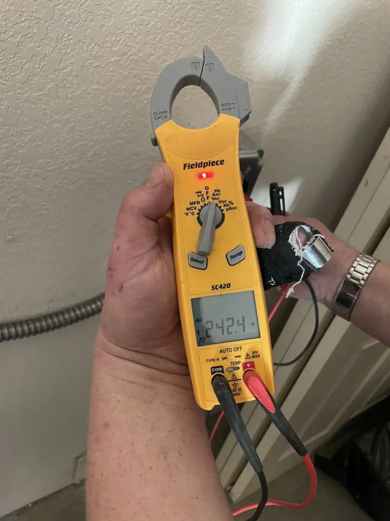 Voltage testing with clamp meter during Generator Installation in Batesville